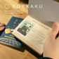 ob1toy x ROKKAKU Passport-Style Notebook - Galaxy Tours
