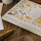 wwiinngg Fine Notebook - Blank&Grid - Sunny Floral World