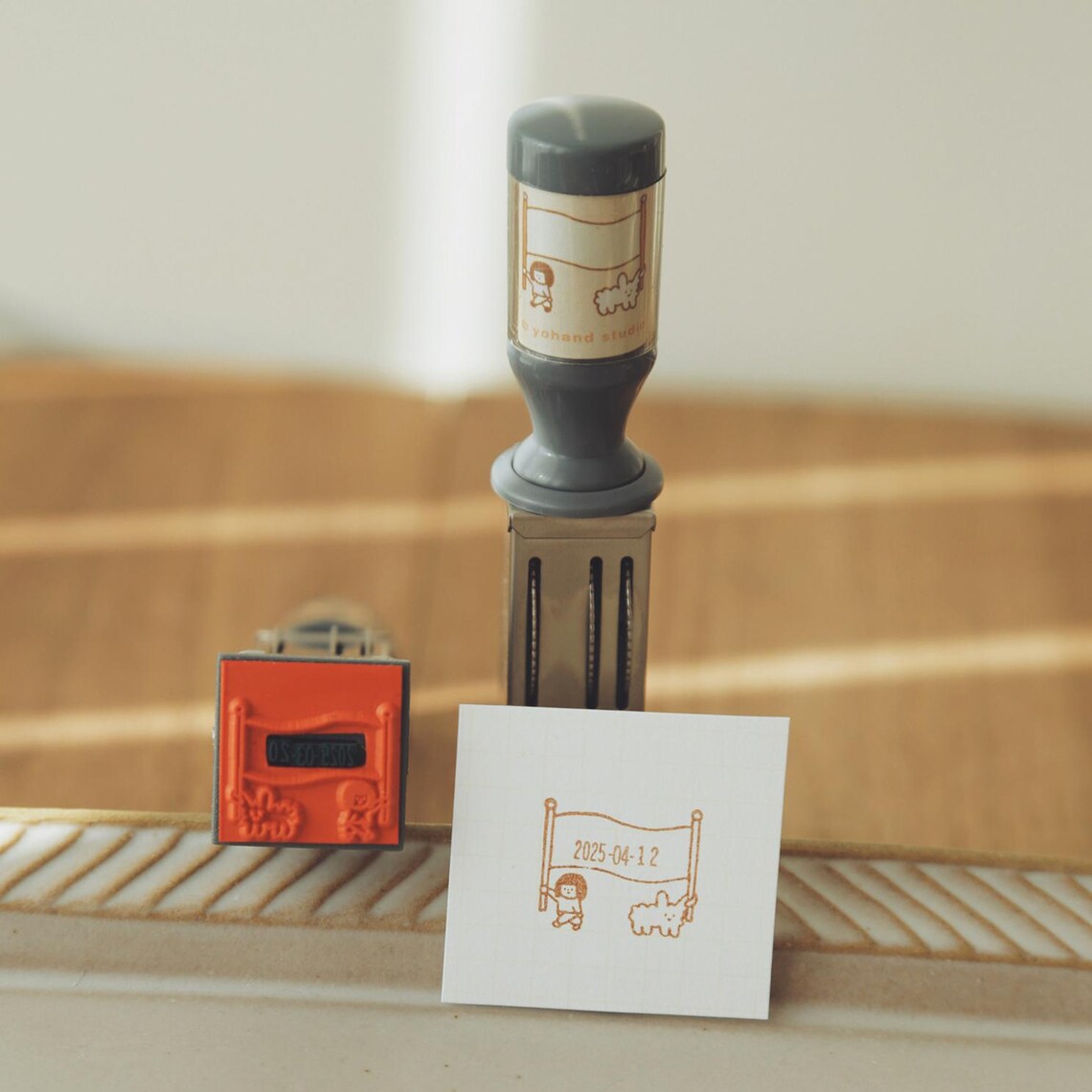 Yohand Studio Small Rotating Date Stamp - Holding Flag