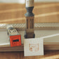 Yohand Studio Small Rotating Date Stamp - Holding Flag