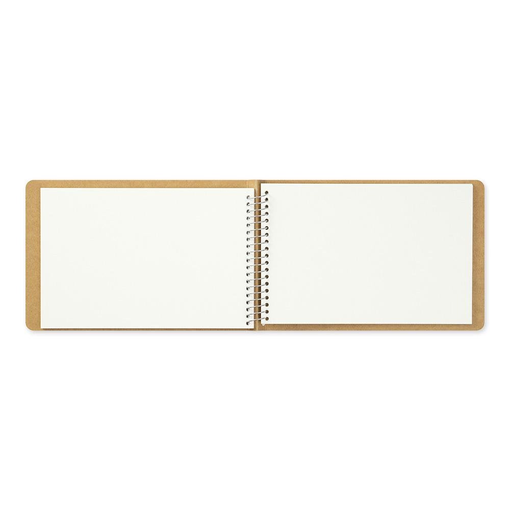 Vertical view of an opened watercolor notebook