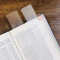 Two clear washi tape cards placing on blink of an opened English book.