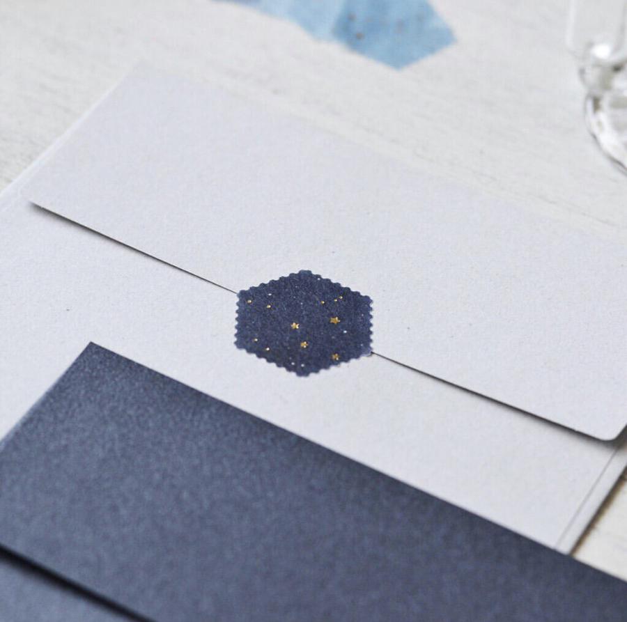 a piece of the dark tone washi seal in actual use on an white envelope